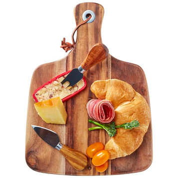 Acacia cheeseboard with knife set, featuring a wooden board, cheese, cured meats, croissant, and cherry tomatoes. Acacia cheeseboard with knife set, featuring a wooden board, cheese, cured meats, croissant, and cherry tomatoes.
