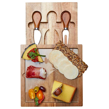 A wooden cheese board with assorted cheeses, meats, crackers, and two stainless steel cheese knives. A wooden cheese board with assorted cheeses, meats, crackers, and two stainless steel cheese knives.