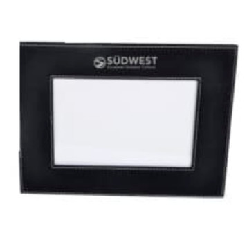 A black 5x7 photo frame with a logo at the top and a blank space for a photo. A black 5x7 photo frame with a logo at the top and a blank space for a photo.