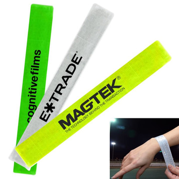 Three reflective slap wristbands in bright green, yellow, and white with logos displayed prominently.