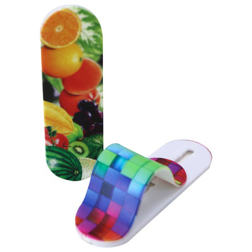 A vibrant, multicoloured smartphone strap features a fruit design on one side and a checkerboard pattern on the other. A vibrant, multicoloured smartphone strap features a fruit design on one side and a checkerboard pattern on the other.