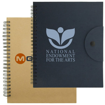 A navy notebook with a logo and a beige notebook, both featuring spiral bindings and a button closure. A navy notebook with a logo and a beige notebook, both featuring spiral bindings and a button closure.