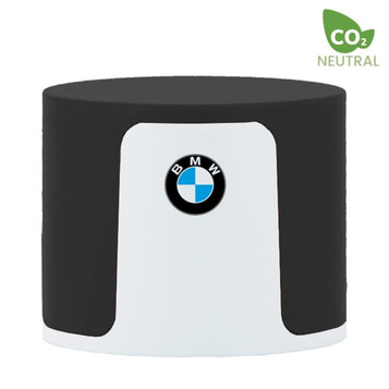 A cylindrical speaker in black and white, featuring a logo on the front and marked as CO2 neutral. A cylindrical speaker in black and white, featuring a logo on the front and marked as CO2 neutral.