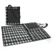 A black and grey checkered picnic blanket with a carrying handle and pocket, folded neatly beside an open version. A black and grey checkered picnic blanket with a carrying handle and pocket, folded neatly beside an open version.