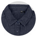 A close-up of a dark denim button-up shirt with a collar and navy buttons. The shirt has a logo tag inside.