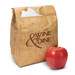 A brown paper lunch bag with a logo and an apple beside it. The bag includes folded napkins inside.
