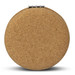 A round compact mirror with a natural cork exterior and a silver clasp. A round compact mirror with a natural cork exterior and a silver clasp.