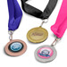 A set of three podium medals featuring gold, silver, and bronze finishes, each attached to different coloured ribbons.
