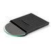 A round glass coaster in a sleek black packaging, featuring a smooth green surface.