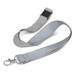 A grey and light blue reflector lanyard with a metal clasp and adjustable clip. It features a simple design. A grey and light blue reflector lanyard with a metal clasp and adjustable clip. It features a simple design.