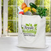 A white bamboo tote bag filled with groceries including vegetables, bread, and water bottles, with a logo on the front. A white bamboo tote bag filled with groceries including vegetables, bread, and water bottles, with a logo on the front.