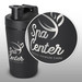 A black protein shaker with a secure lid, featuring a logo on the side and a sleek, matte finish. A black protein shaker with a secure lid, featuring a logo on the side and a sleek, matte finish.