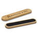 A bamboo nail file in natural wood with a black sanding surface and a logo on one side. A bamboo nail file in natural wood with a black sanding surface and a logo on one side.