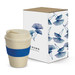 A drink bottle with a natural finish and a blue band, next to a decorative box featuring floral designs.