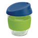 A drink bottle made of borosilicate glass, featuring a blue lid and a green silicone band for grip.