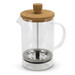 A glass coffee plunger with a cork lid, metal filter, and a black handle, designed for brewing coffee or tea. A glass coffee plunger with a cork lid, metal filter, and a black handle, designed for brewing coffee or tea.