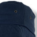A navy Yuma Bucket Hat featuring a textured fabric and ventilation eyelets. The hat has a logo on it. A navy Yuma Bucket Hat featuring a textured fabric and ventilation eyelets. The hat has a logo on it.