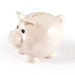 A small pig-shaped eco coin bank with a light speckled finish and oversized cartoonish eyes.