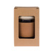 A reusable coffee cup in a cardboard box features a cork band and a white lid, combining natural materials and style. A reusable coffee cup in a cardboard box features a cork band and a white lid, combining natural materials and style.