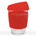 A reusable coffee cup with a transparent glass body and a bright red silicone lid and sleeve. A reusable coffee cup with a transparent glass body and a bright red silicone lid and sleeve.