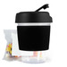 A reusable coffee cup with a black silicone sleeve and a secure lid, accompanied by a pack of colorful jelly beans. A reusable coffee cup with a black silicone sleeve and a secure lid, accompanied by a pack of colorful jelly beans.