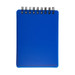 A blue, spiral-bound pocket notebook with a smooth cover and blank pages.