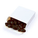 A box of black jelly beans is partially opened, with several beans spilling out onto a white background. A box of black jelly beans is partially opened, with several beans spilling out onto a white background.