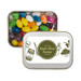 A silver rectangular tin filled with assorted color mini jelly beans, featuring a label that reads "Lush Olive Farms." A silver rectangular tin filled with assorted color mini jelly beans, featuring a label that reads "Lush Olive Farms."