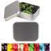 Silver rectangular tin filled with green and black jelly beans, with a variety of colorful jelly beans displayed below. Silver rectangular tin filled with green and black jelly beans, with a variety of colorful jelly beans displayed below.
