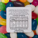 Assorted mini jelly beans in various vibrant colors, presented in a pillow pack with nutritional information. Assorted mini jelly beans in various vibrant colors, presented in a pillow pack with nutritional information.