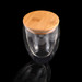 A drink bottle featuring a transparent double wall glass design with a bamboo lid.