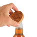 A drink bottle opener coaster in bamboo with a hand positioned above it, showing its natural wood color and branding. A drink bottle opener coaster in bamboo with a hand positioned above it, showing its natural wood color and branding.