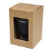 A reusable coffee cup in black, packaged in a brown cardboard box with a clear window. It includes a snap lid. A reusable coffee cup in black, packaged in a brown cardboard box with a clear window. It includes a snap lid.