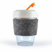 A reusable coffee cup with a clear glass base, a grey felt band, and a white lid with an orange straw. A reusable coffee cup with a clear glass base, a grey felt band, and a white lid with an orange straw.