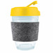 A reusable coffee cup with a yellow flip lid and a gray felt band around a transparent body. Features a logo. A reusable coffee cup with a yellow flip lid and a gray felt band around a transparent body. Features a logo.