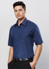 A dark blue short sleeve button-up shirt with a micro check pattern and one breast pocket. Features a logo on the shirt.