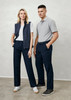 A man and woman stand together. The man wears grey polo and navy slacks; the woman wears a white t-shirt, navy vest, and navy trousers. A man and woman stand together. The man wears grey polo and navy slacks; the woman wears a white t-shirt, navy vest, and navy trousers.