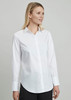 A white long sleeve button-up shirt on a model, featuring a classic collar and a curved hem.