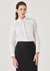 A white long sleeve button-up shirt displayed on a model, paired with a black skirt. The shirt has a collar and features a logo. A white long sleeve button-up shirt displayed on a model, paired with a black skirt. The shirt has a collar and features a logo.