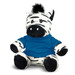 A plush zebra toy with black and white stripes, wearing a blue shirt, featuring a tuft of black hair on its head.