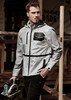 A reflective grey waterproof jacket with a black pocket, worn by a male model, showcasing a stylish and functional design. A reflective grey waterproof jacket with a black pocket, worn by a male model, showcasing a stylish and functional design.