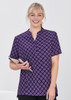 A women's tunic in dark purple featuring a daisy print design, with a short collar and short sleeves.