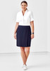 A model wears a white shirt and a navy women's comfort waist skort with buttons, featuring a sleek design.