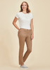Women's slim leg stretch chino pant in tan, paired with a white top, featured on a neutral background. Women's slim leg stretch chino pant in tan, paired with a white top, featured on a neutral background.