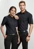 A black short sleeve button-up shirt for women, featuring two chest pockets and a branded logo.
