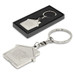 A metal key ring shaped like a house, featuring a logo, presented in a black box. Silver in colour. A metal key ring shaped like a house, featuring a logo, presented in a black box. Silver in colour.