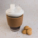 A reusable coffee cup featuring a white snap lid and a cork band, accompanied by a few cookies. A reusable coffee cup featuring a white snap lid and a cork band, accompanied by a few cookies.