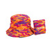A bucket hat in vibrant orange, purple, and pink camouflage, paired with a matching pouch. It features a logo.