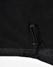 A close-up of the bottom hem of a black unisex jacket featuring a drawstring adjustment.