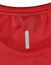 A close-up of a red ultra-lightweight performance T-shirt featuring a small logo on the back.